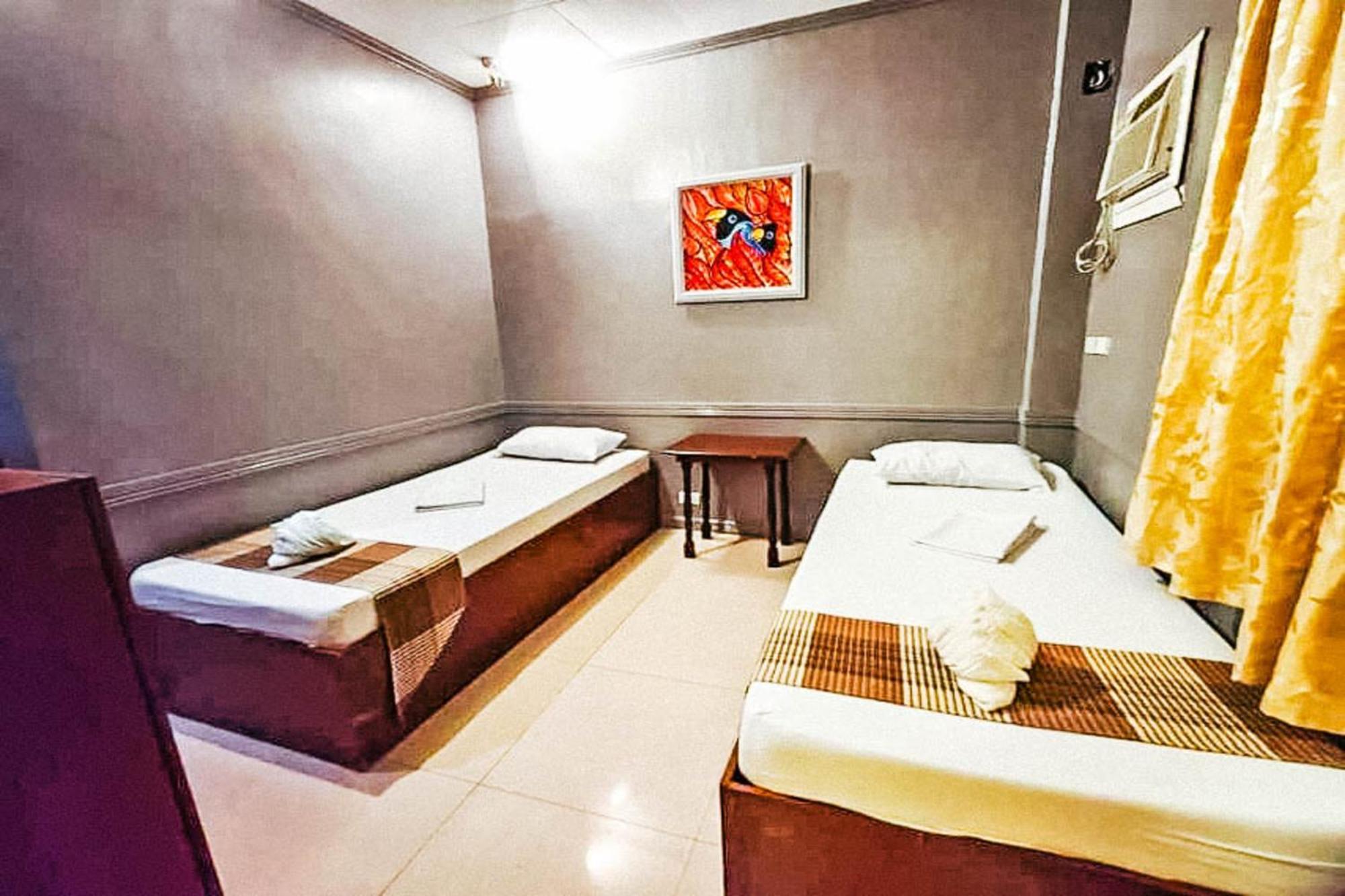 Mbg Travellers Inn Powered By Cocotel بويرتو برينسيسا الغرفة الصورة