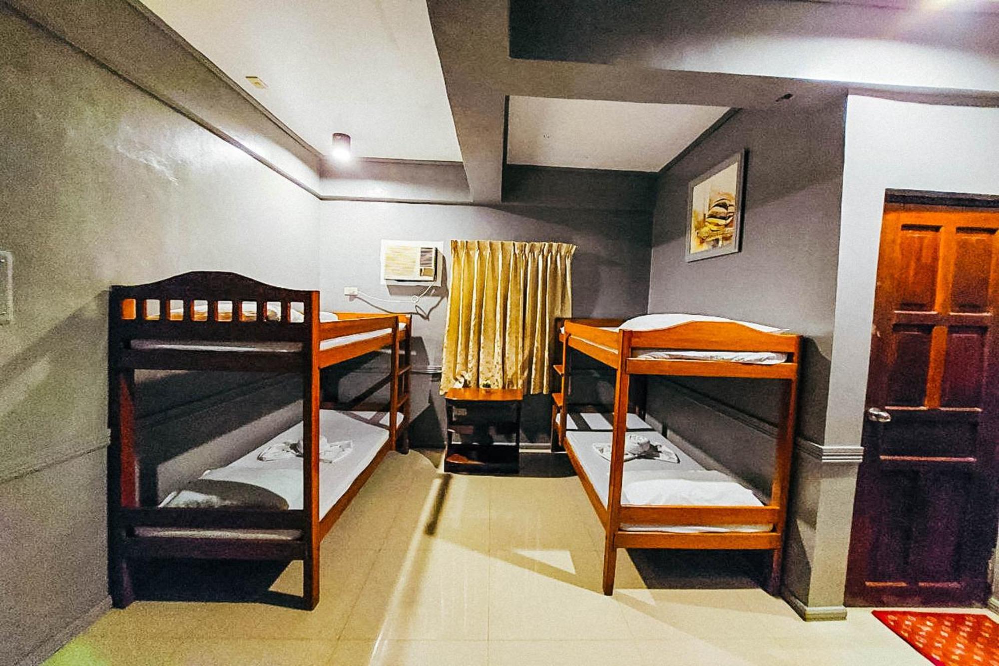Mbg Travellers Inn Powered By Cocotel بويرتو برينسيسا الغرفة الصورة