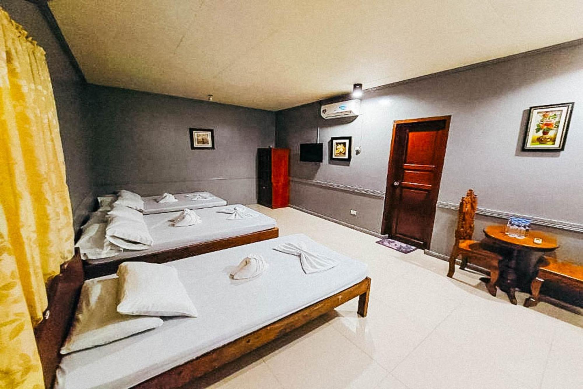 Mbg Travellers Inn Powered By Cocotel بويرتو برينسيسا الغرفة الصورة
