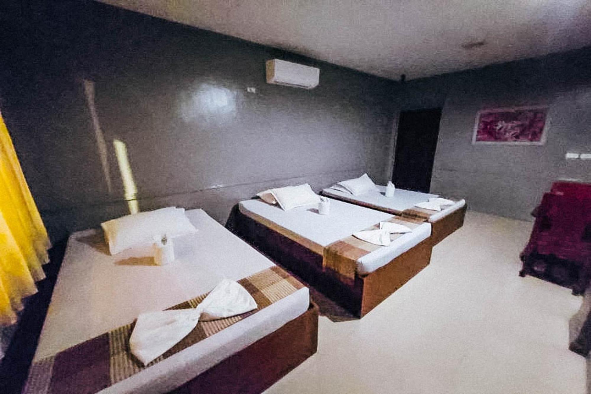 Mbg Travellers Inn Powered By Cocotel بويرتو برينسيسا الغرفة الصورة