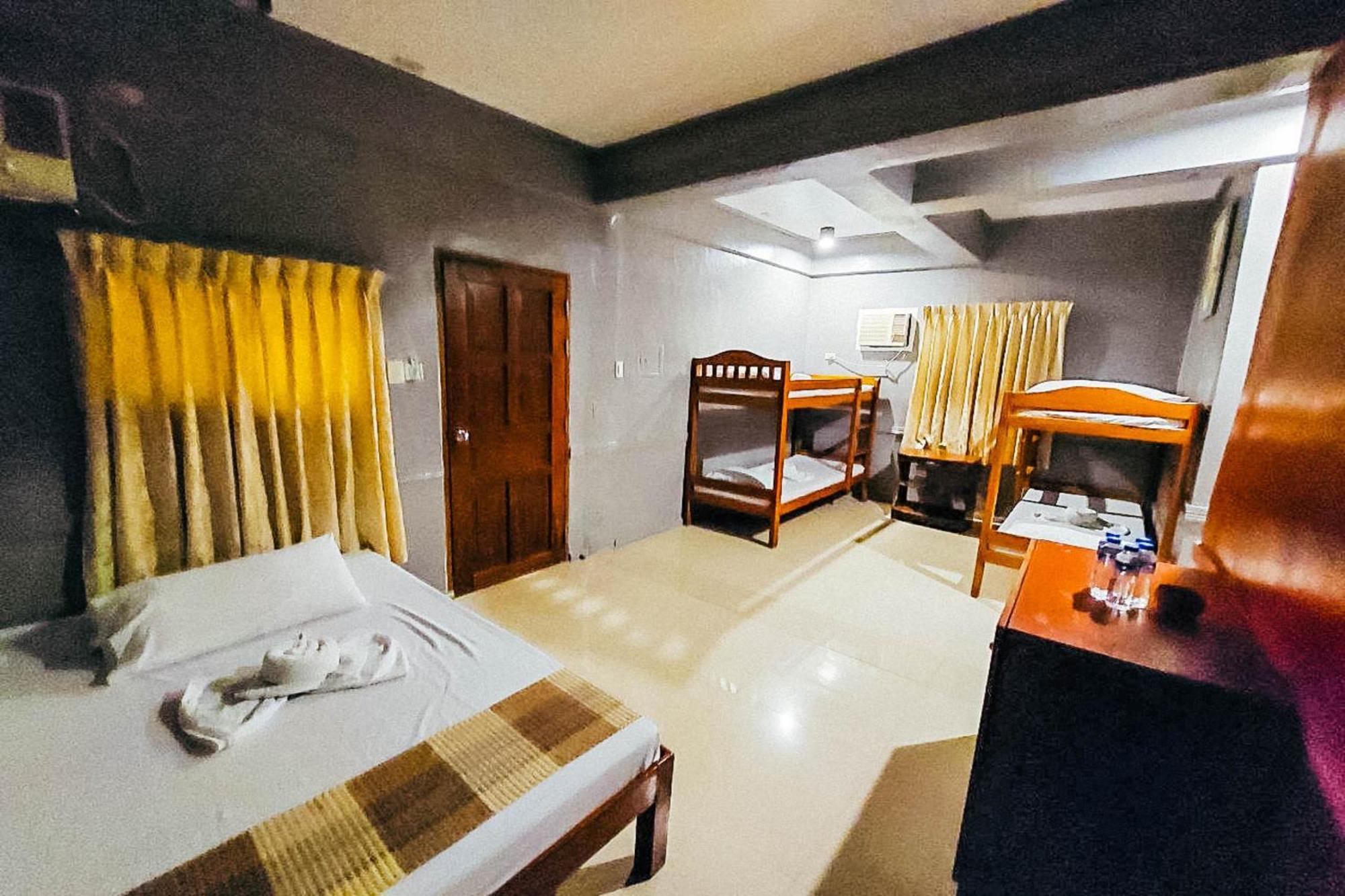 Mbg Travellers Inn Powered By Cocotel بويرتو برينسيسا الغرفة الصورة