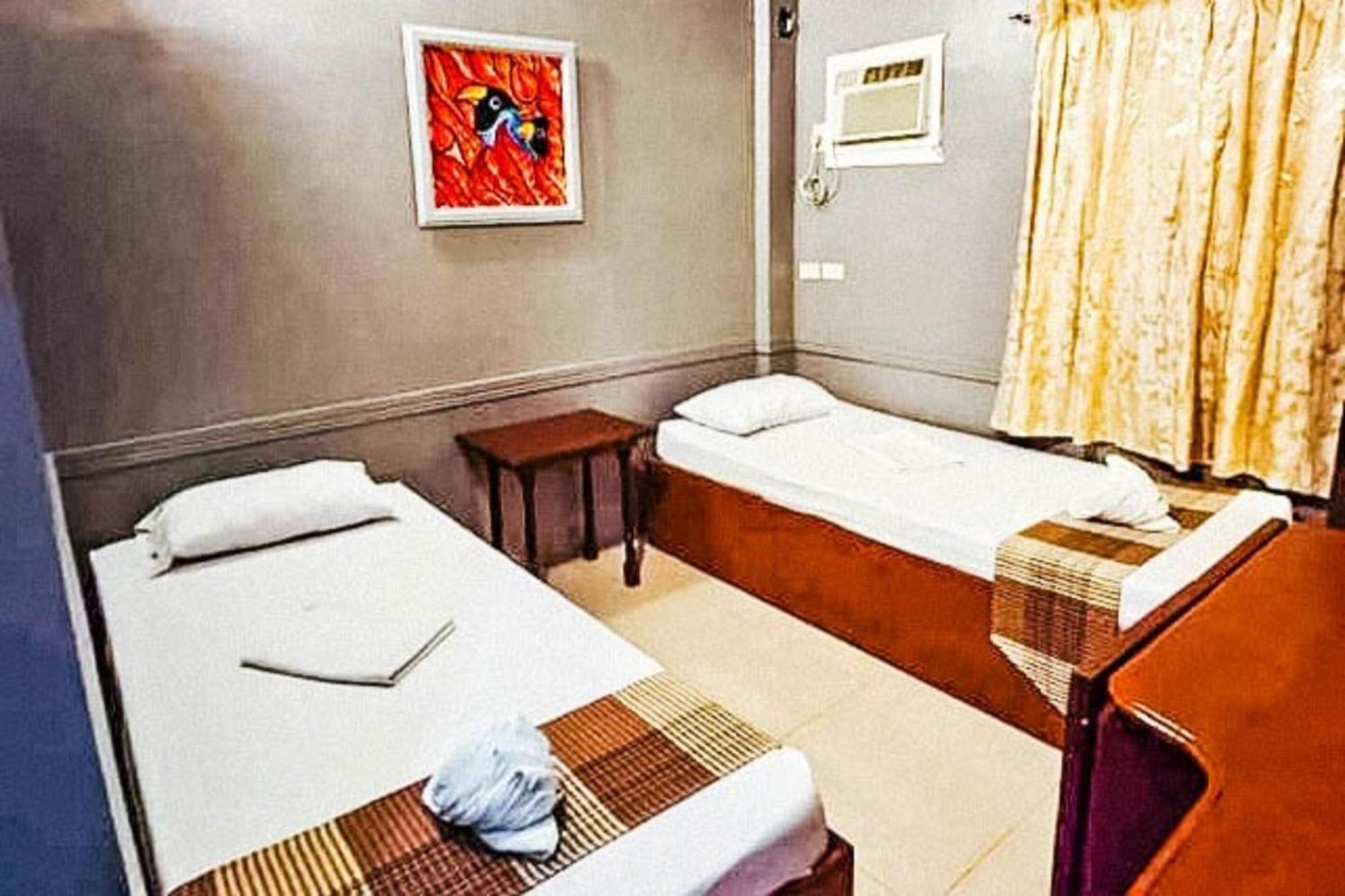 Mbg Travellers Inn Powered By Cocotel بويرتو برينسيسا الغرفة الصورة