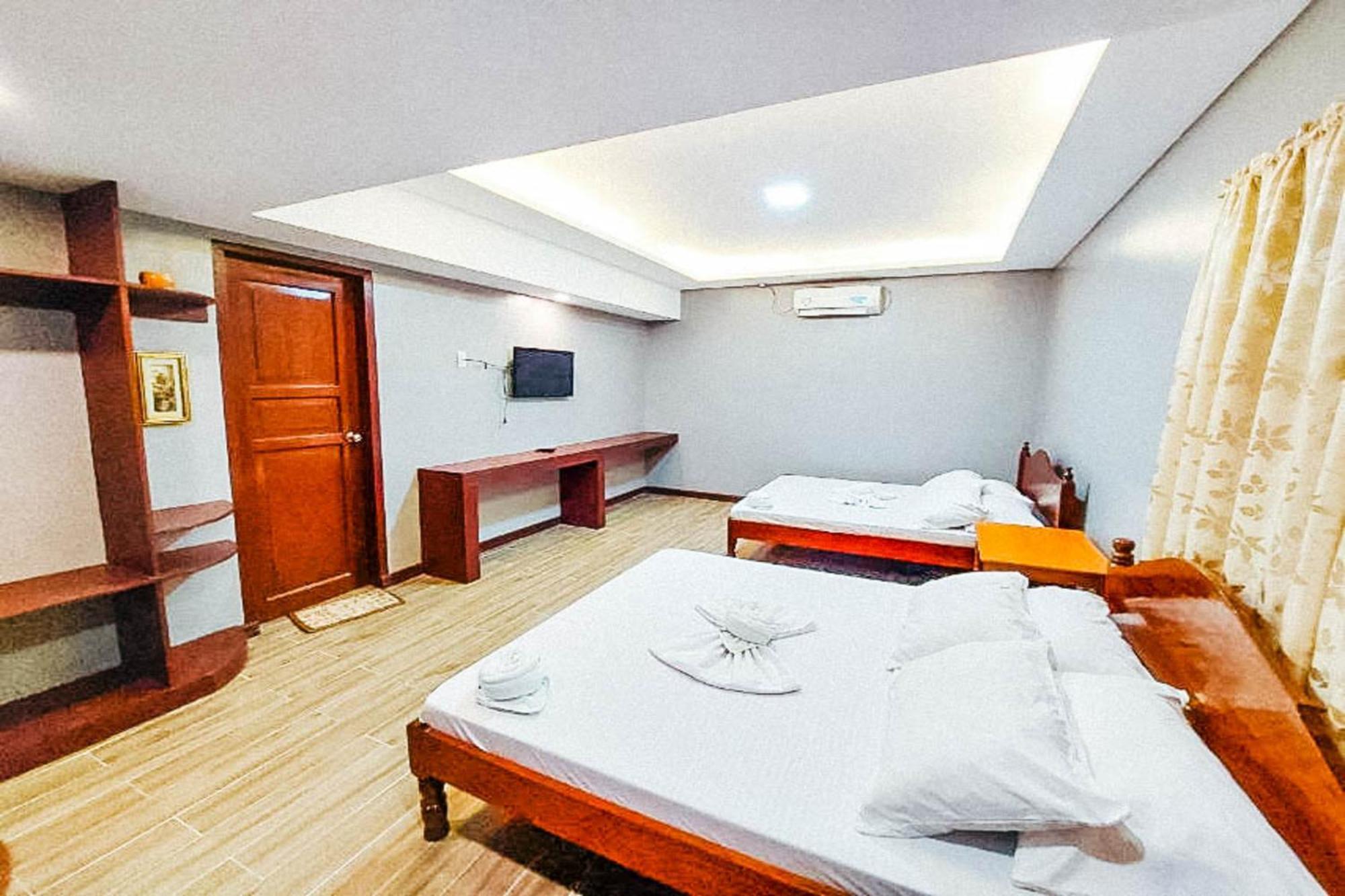 Mbg Travellers Inn Powered By Cocotel بويرتو برينسيسا الغرفة الصورة