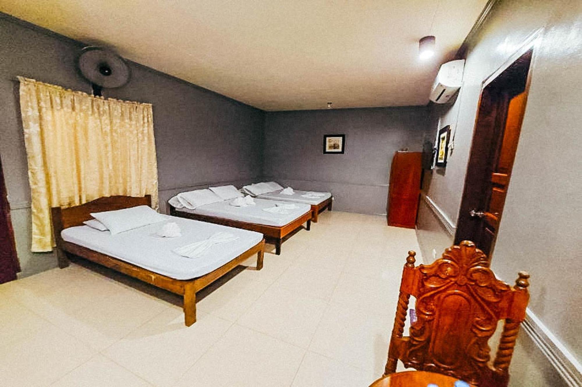 Mbg Travellers Inn Powered By Cocotel بويرتو برينسيسا الغرفة الصورة