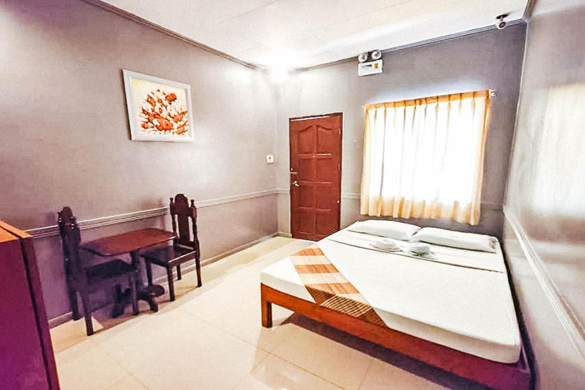 Mbg Travellers Inn Powered By Cocotel بويرتو برينسيسا الغرفة الصورة