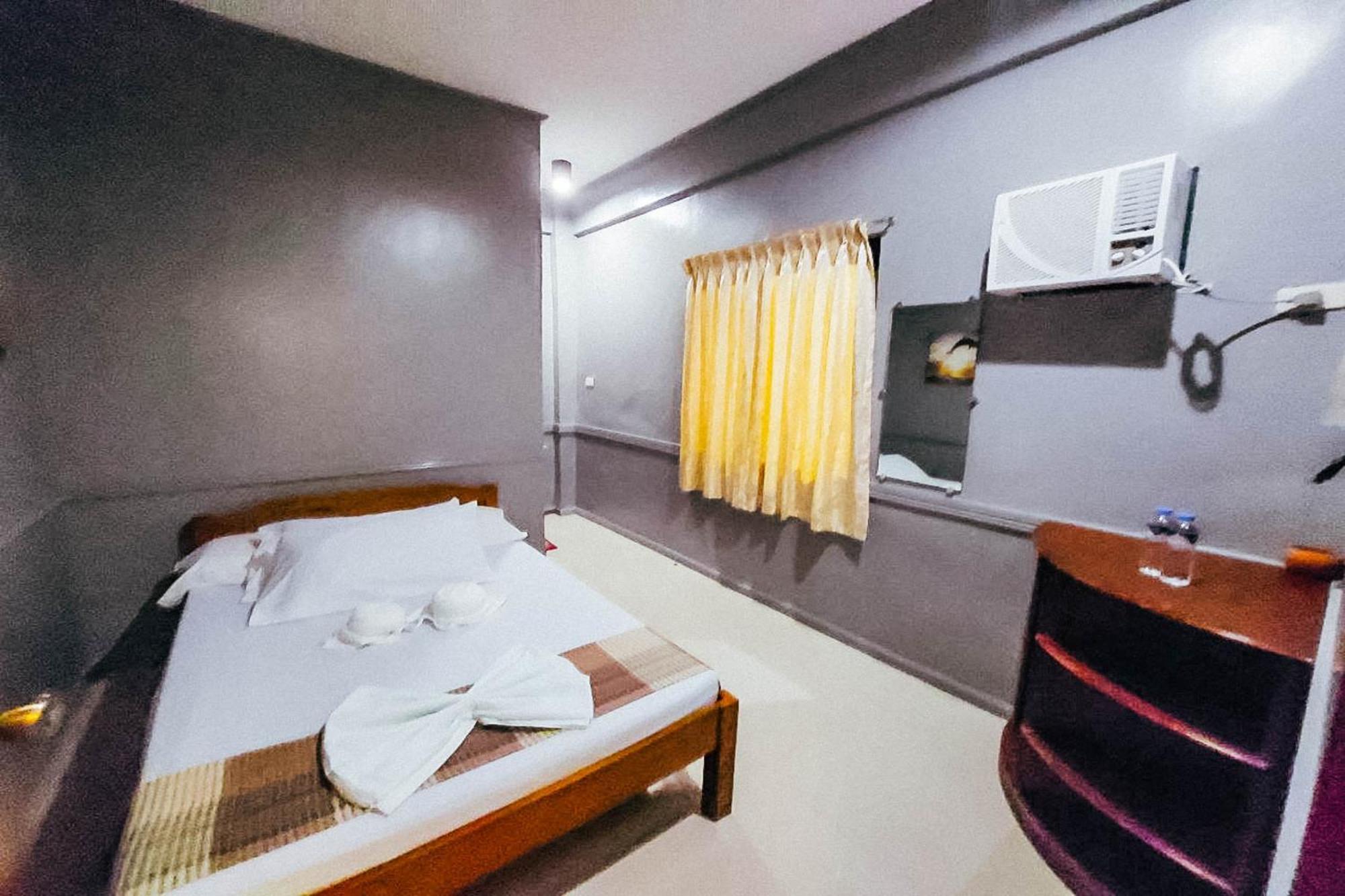 Mbg Travellers Inn Powered By Cocotel بويرتو برينسيسا الغرفة الصورة